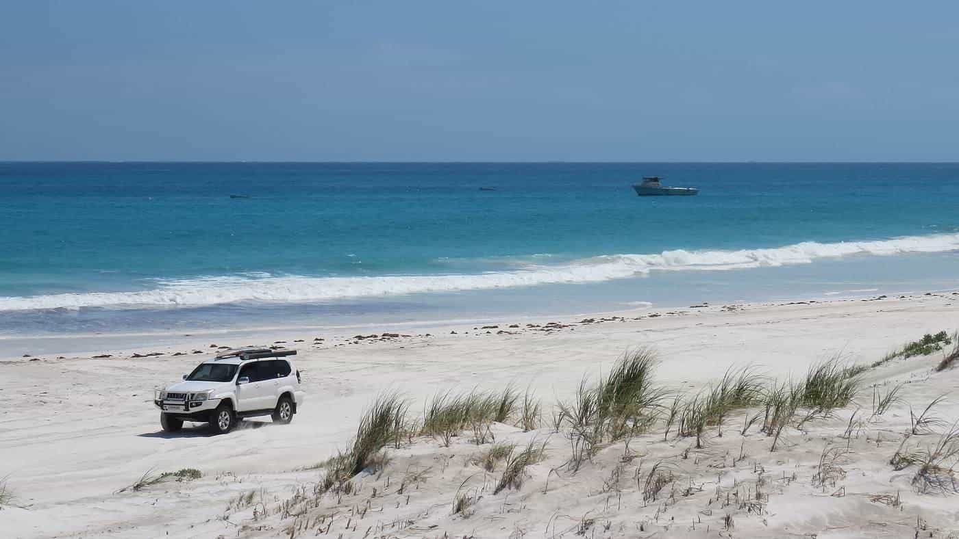 A four-wheel drive on the beach at Wedge Island, Western Australia