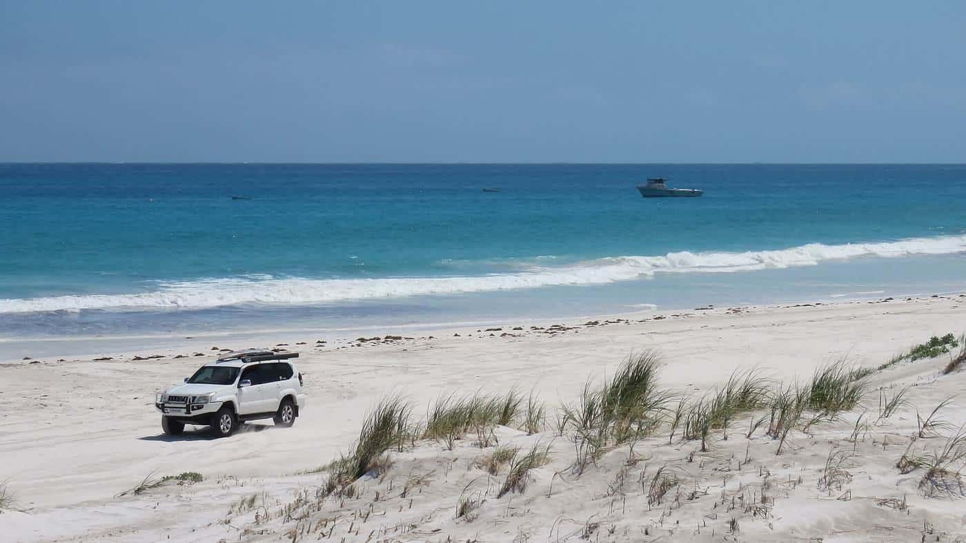A four-wheel drive on a beach in Western Australia