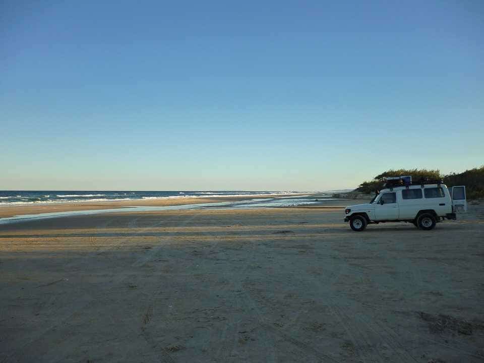 A four-wheel drive on the sand at K'gari (Fraser Island)