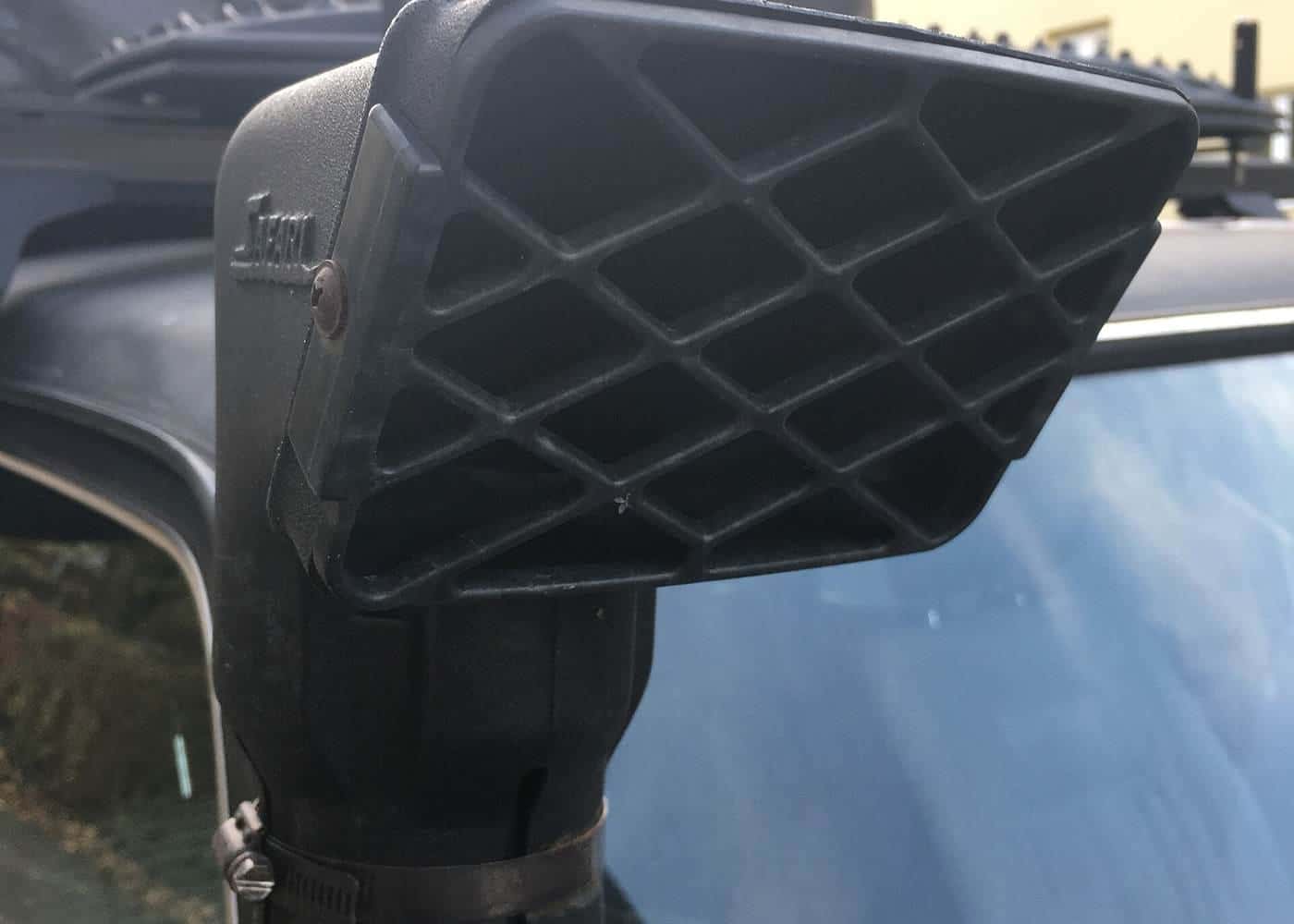 A snorkel air intake mounted at roof height on a Toyota LandCruiser